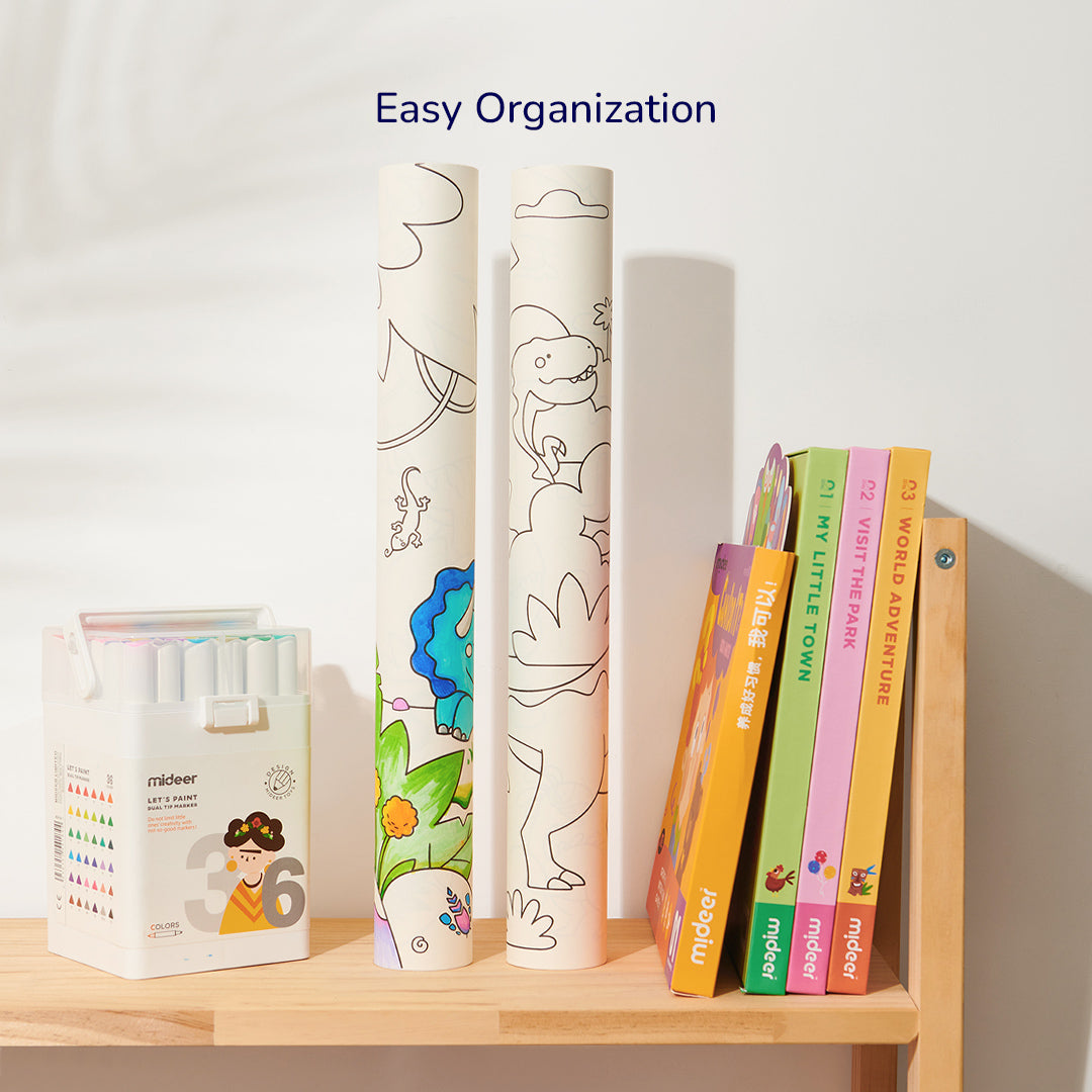 Giant coloring scroll with city elements for children next to books and markers on wooden shelf with text &