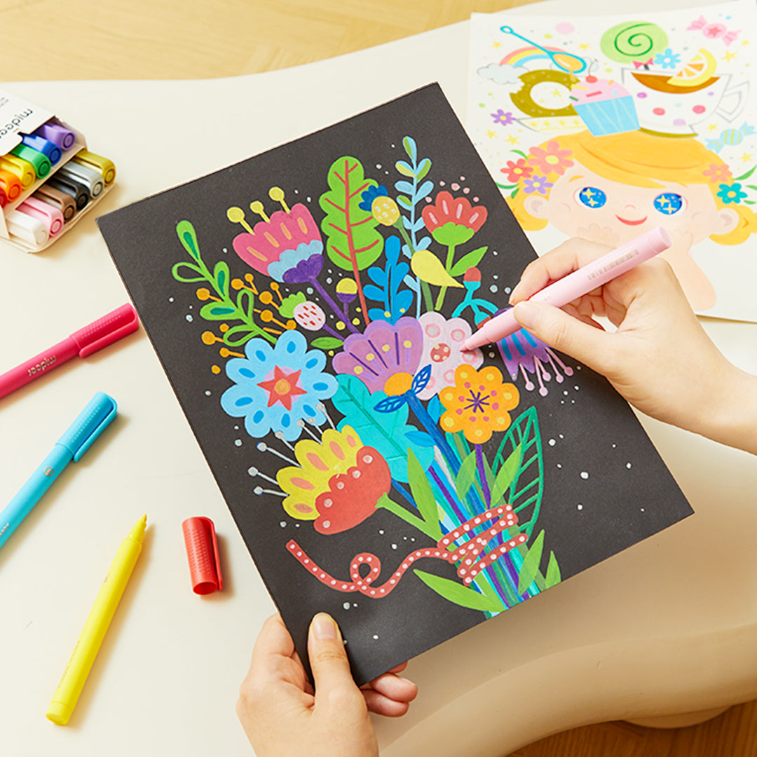 Child using acrylic markers with round nib to create a colorful bouquet on black paper suitable for ages 4 and up.