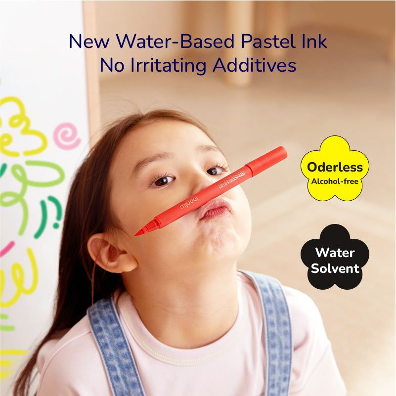 Child playing with an acrylic marker from the 12 Colors Ultra Soft Nib set that is odorless, water-based, and free from irritating additives.