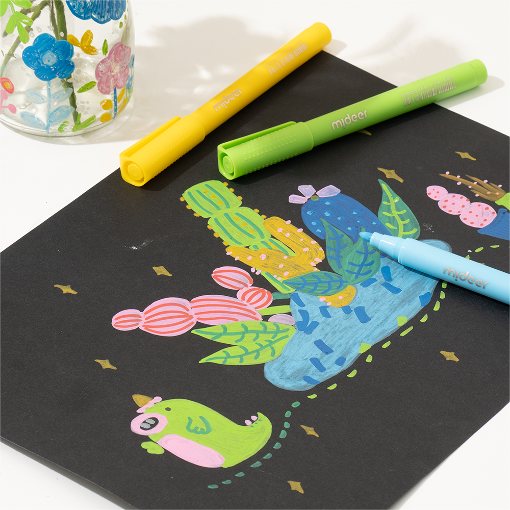Acrylic markers with ultra soft nib creating vibrant art on black paper with colorful whimsical animal and plant designs.